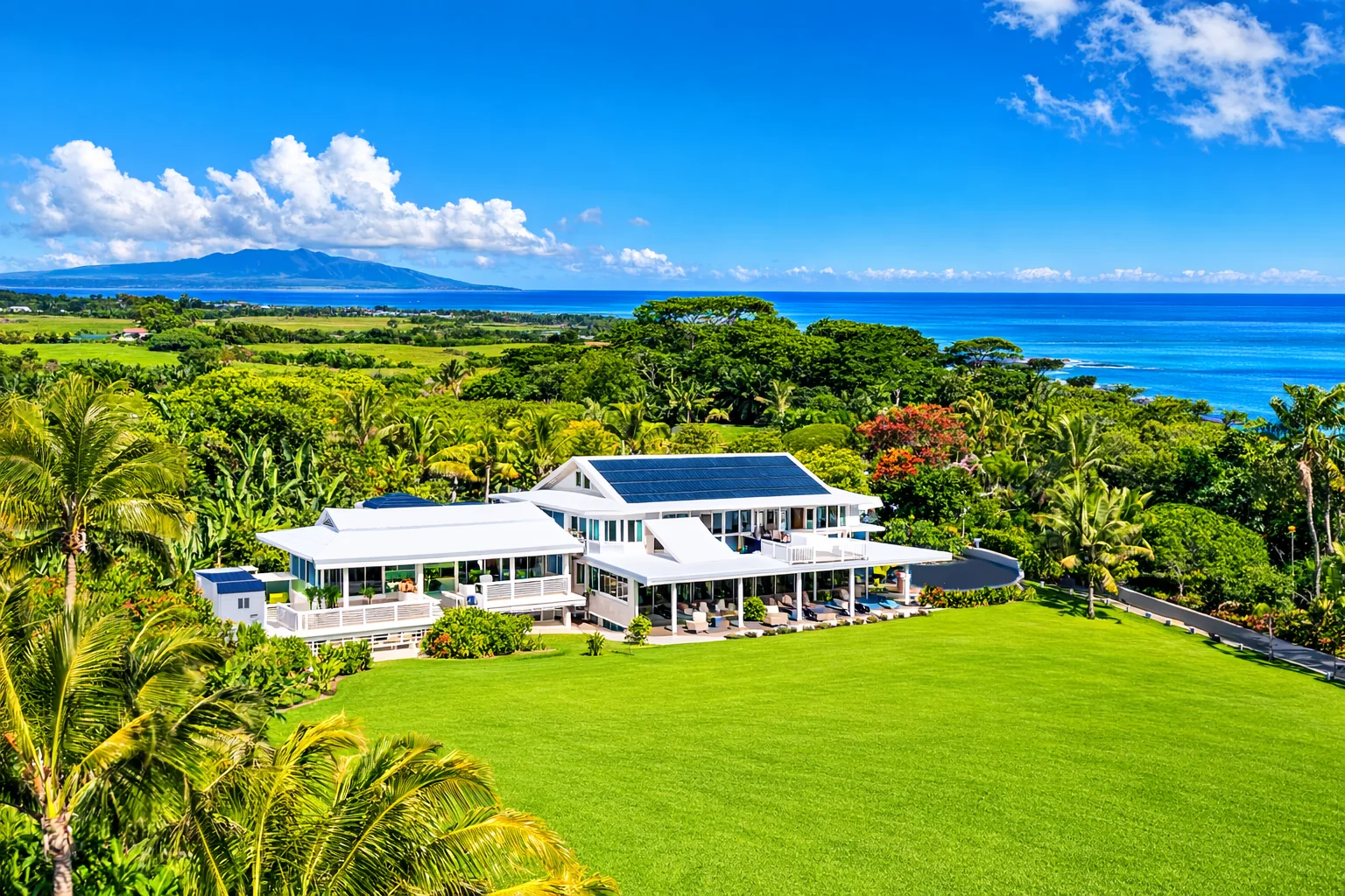 Aerial view of Hawaii Wellness Retreat estate surrounded by tropical greenery and ocean views